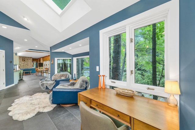 679 Kearsarge Rd, Conway, NH 03860 - living area with healthy amount of natural light, a skylight, concrete floors, recessed lighting, and vaulted ceiling