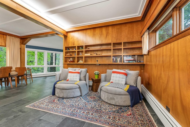 679 Kearsarge Rd, Conway, NH 03860 - living area with a baseboard radiator, wood walls, and crown molding