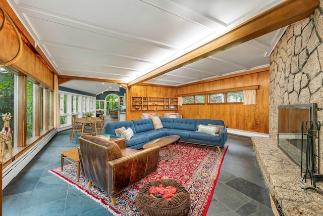 679 Kearsarge Rd, Conway, NH 03860 - living area with lofted ceiling, baseboard heating, wood walls, and a fireplace