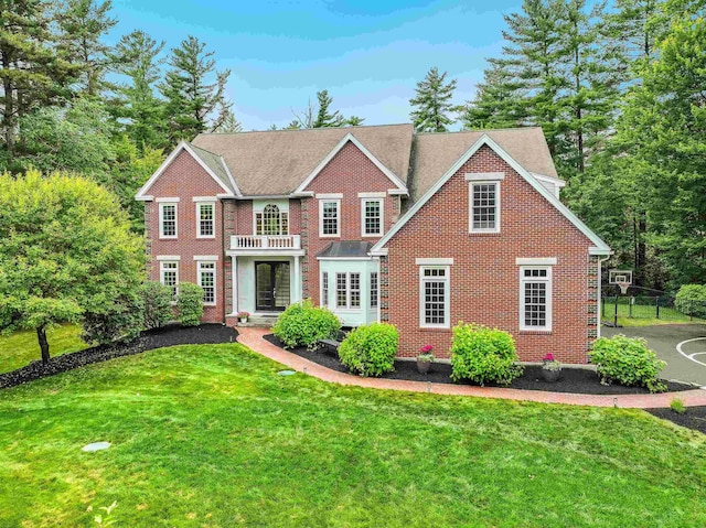 4 Chablis Ct, Bedford, NH 03110 - georgian-style home with a front yard, brick siding, and a balcony