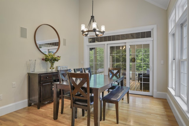 4 Chablis Ct, Bedford, NH 03110 - dining area with a chandelier, high vaulted ceiling, light wood-type flooring, and healthy amount of natural light