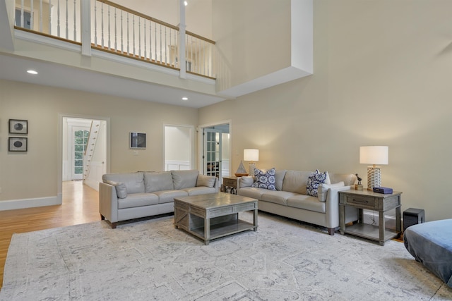 4 Chablis Ct, Bedford, NH 03110 - living room with wood finished floors, a high ceiling, recessed lighting, and stairway