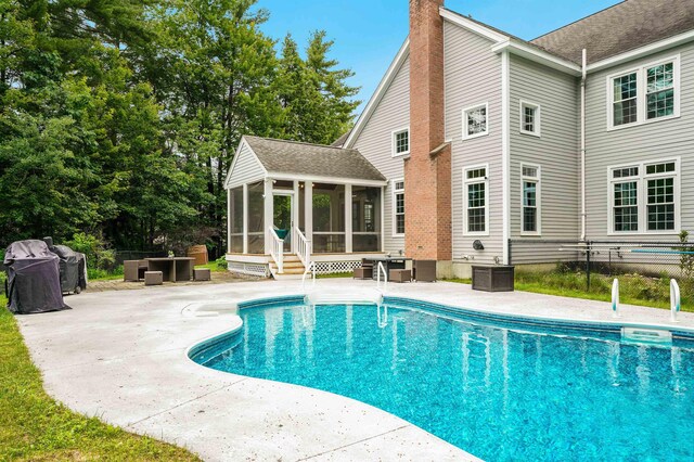4 Chablis Ct, Bedford, NH 03110 - swimming pool featuring a sunroom and a patio