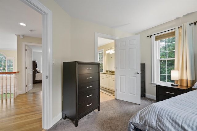 4 Chablis Ct, Bedford, NH 03110 - bedroom featuring multiple windows, a chandelier, and ensuite bath