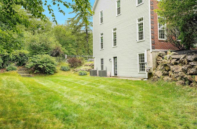 4 Chablis Ct, Bedford, NH 03110 - back of house featuring a yard and brick siding