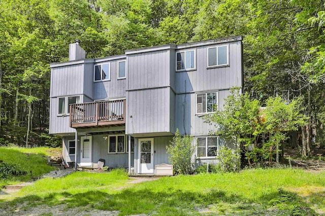 37 Eastside Ln Unit 1, Francestown, NH 03043 - back of house with a chimney and a deck