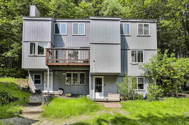 37 Eastside Ln Unit 1, Francestown, NH 03043 - rear view of property featuring a deck and a chimney