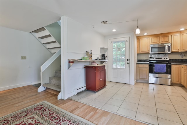 37 Eastside Ln Unit 1, Francestown, NH 03043 - kitchen featuring stainless steel appliances, recessed lighting, light wood finished floors, a baseboard heating unit, and dark countertops