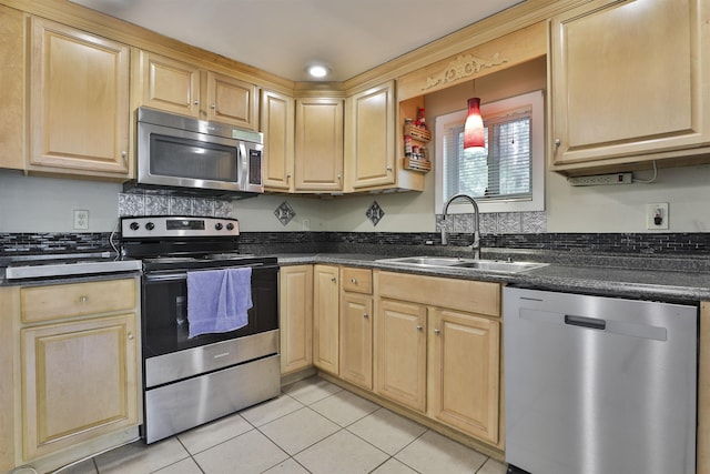 37 Eastside Ln Unit 1, Francestown, NH 03043 - kitchen with stainless steel appliances, dark countertops, and light tile patterned floors