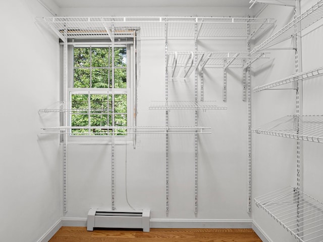 44 Mcquade Brook Rd, Bedford, NH 03110 - spacious closet with a baseboard heating unit and wood finished floors