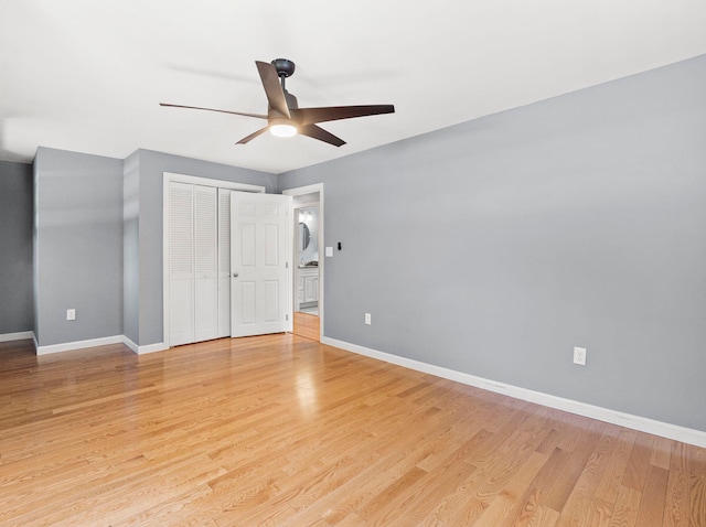 44 Mcquade Brook Rd, Bedford, NH 03110 - unfurnished bedroom with light wood finished floors, a closet, and a ceiling fan