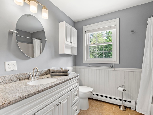 44 Mcquade Brook Rd, Bedford, NH 03110 - bathroom featuring baseboard heating, wainscoting, vanity, tile patterned floors, and curtained shower