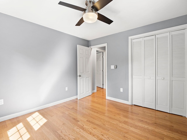 44 Mcquade Brook Rd, Bedford, NH 03110 - unfurnished bedroom featuring light wood-type flooring, a closet, and ceiling fan