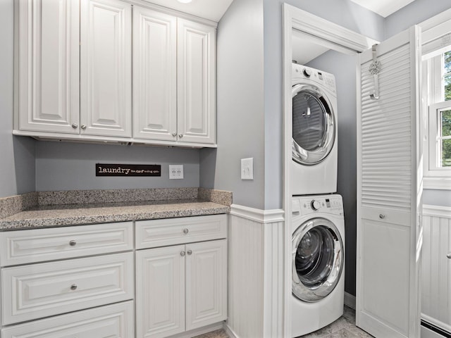 44 Mcquade Brook Rd, Bedford, NH 03110 - laundry area with estacked washer and dryer and a wainscoted wall