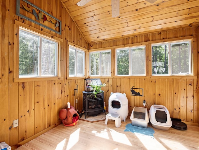 44 Mcquade Brook Rd, Bedford, NH 03110 - sunroom with a wood stove, healthy amount of natural light, and vaulted ceiling