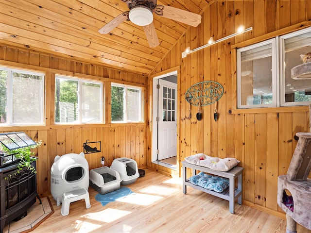 44 Mcquade Brook Rd, Bedford, NH 03110 - sunroom featuring lofted ceiling and a wood stove