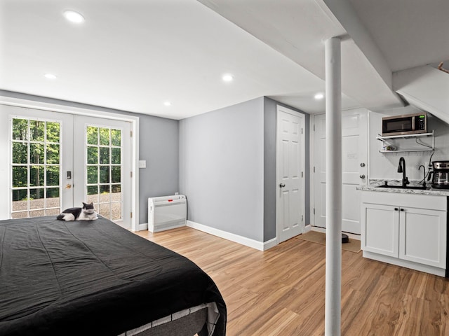 44 Mcquade Brook Rd, Bedford, NH 03110 - bedroom featuring access to exterior, light wood-style flooring, french doors, recessed lighting, and bar area