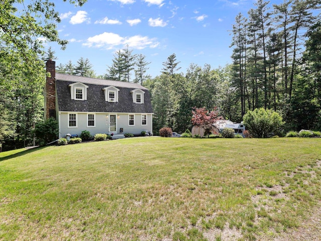 44 Mcquade Brook Rd, Bedford, NH 03110 - colonial inspired home with a chimney, a front yard, and roof with shingles