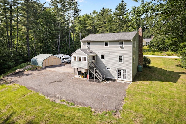 44 Mcquade Brook Rd, Bedford, NH 03110 - back of house with a chimney, a storage unit, a yard, french doors, and stairway