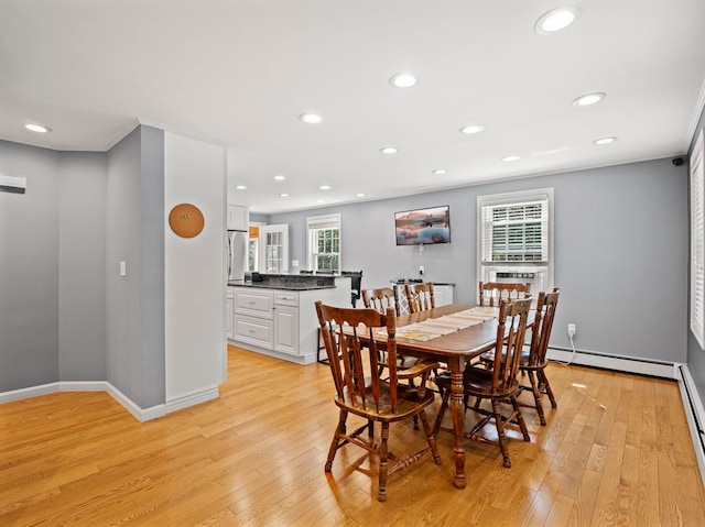 44 Mcquade Brook Rd, Bedford, NH 03110 - dining room featuring light wood-type flooring, recessed lighting, a baseboard radiator, and crown molding