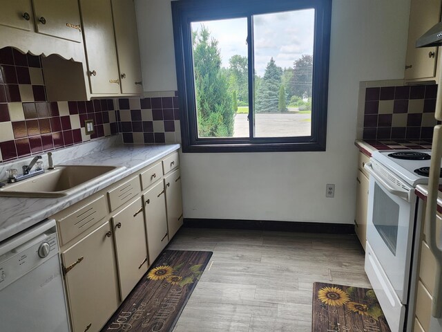 33 Pendleton Ln, Londonderry, NH 03053 - kitchen with white appliances, light countertops, backsplash, and wall chimney exhaust hood