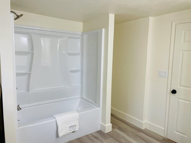 17 Arch St, Laconia, NH 03246 - full bathroom featuring wood finished floors and washtub / shower combination