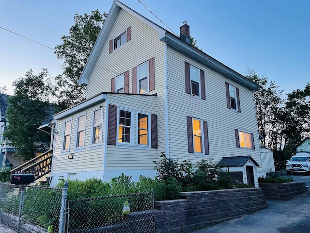 17 Arch St, Laconia, NH 03246 - view of side of home featuring a chimney