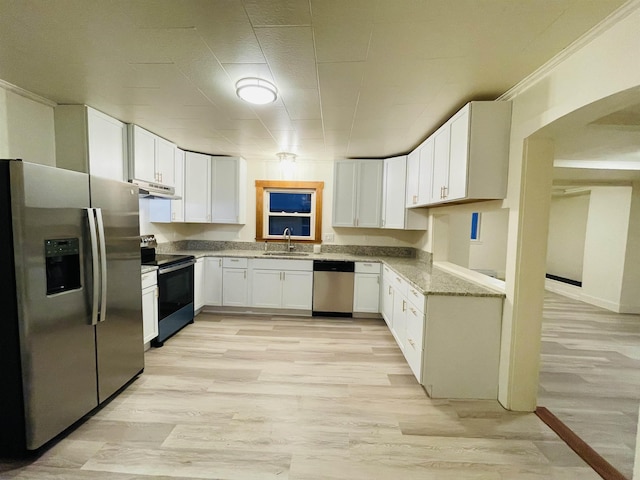17 Arch St, Laconia, NH 03246 - kitchen with appliances with stainless steel finishes, light stone counters, white cabinetry, and light wood-type flooring