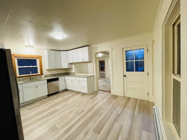 17 Arch St, Laconia, NH 03246 - kitchen featuring stainless steel appliances, a baseboard radiator, arched walkways, white cabinetry, and light wood-style flooring
