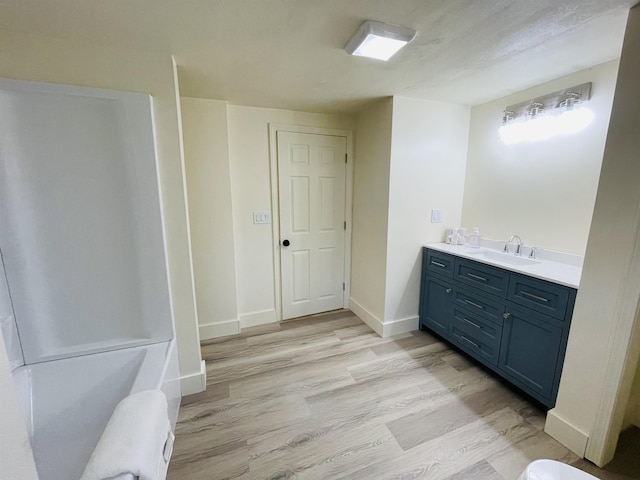 17 Arch St, Laconia, NH 03246 - full bathroom with vanity and wood finished floors