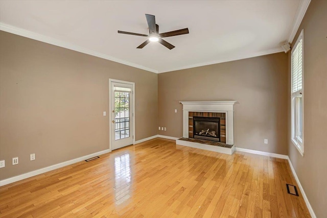 473 Brennan Woods Dr, Williston, VT 05495 - unfurnished living room featuring a ceiling fan, light wood finished floors, a brick fireplace, and ornamental molding