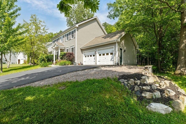 473 Brennan Woods Dr, Williston, VT 05495 - view of front of house with asphalt driveway and a garage