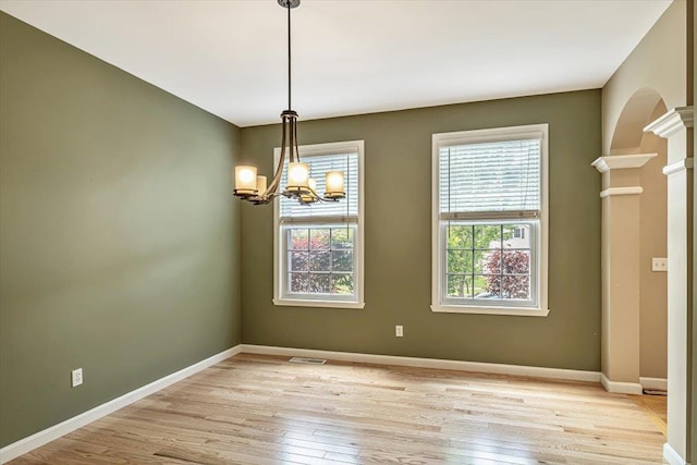 473 Brennan Woods Dr, Williston, VT 05495 - empty room with light wood-style floors and a chandelier