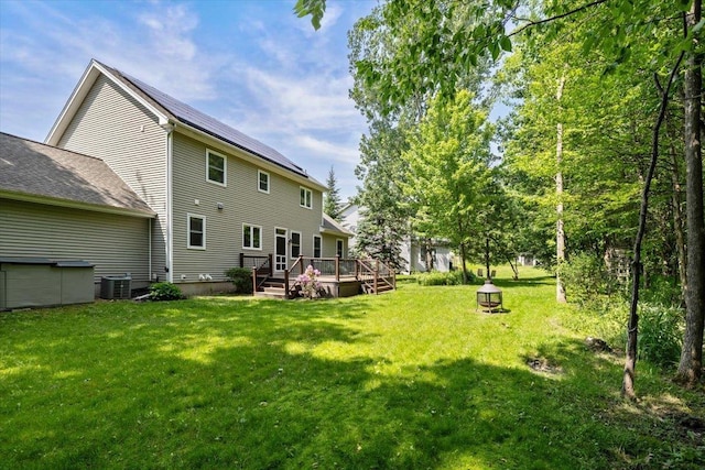 473 Brennan Woods Dr, Williston, VT 05495 - view of green lawn with a wooden deck