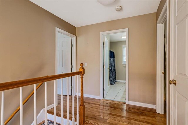 473 Brennan Woods Dr, Williston, VT 05495 - hallway featuring light wood finished floors and an upstairs landing