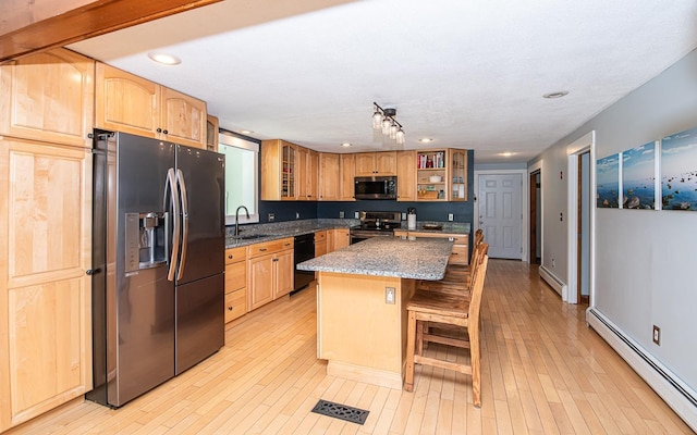 33 Hillside Rd, Kingston, NH 03848 - kitchen featuring appliances with stainless steel finishes, a baseboard heating unit, glass insert cabinets, stone countertops, and recessed lighting