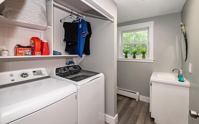 33 Hillside Rd, Kingston, NH 03848 - washroom with a baseboard radiator, washing machine and clothes dryer, and dark wood-style floors