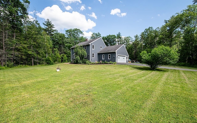 33 Hillside Rd, Kingston, NH 03848 - view of front of home with driveway, a chimney, an attached garage, and a front yard