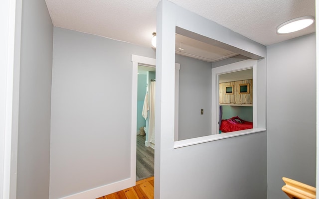 33 Hillside Rd, Kingston, NH 03848 - hallway featuring wood finished floors and a textured ceiling
