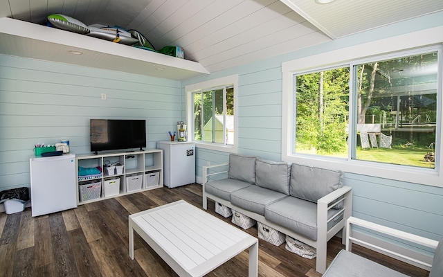 33 Hillside Rd, Kingston, NH 03848 - living room with lofted ceiling, wood finished floors, and wooden walls