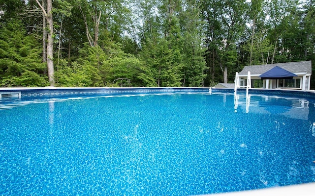 33 Hillside Rd, Kingston, NH 03848 - outdoor pool with a wooded view