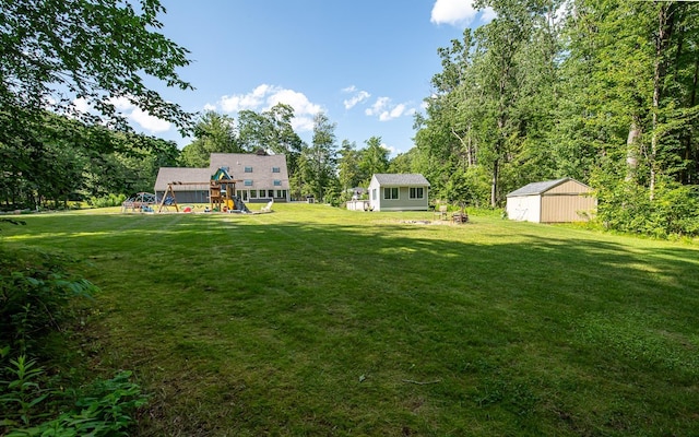 33 Hillside Rd, Kingston, NH 03848 - view of grassy yard featuring a playground and an outdoor structure