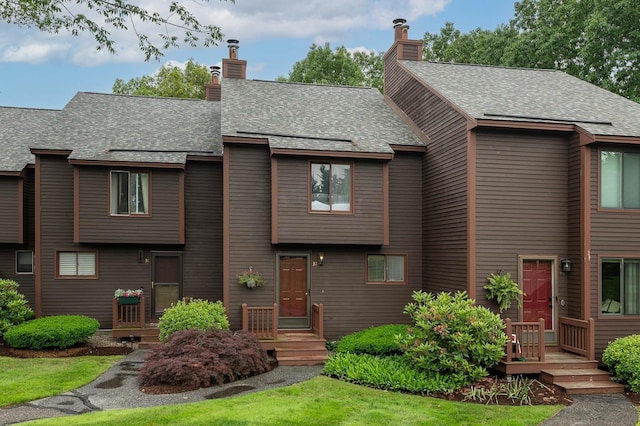 37 Thornhill Rd, Stratham, NH 03885 - view of front of property with a chimney and a shingled roof