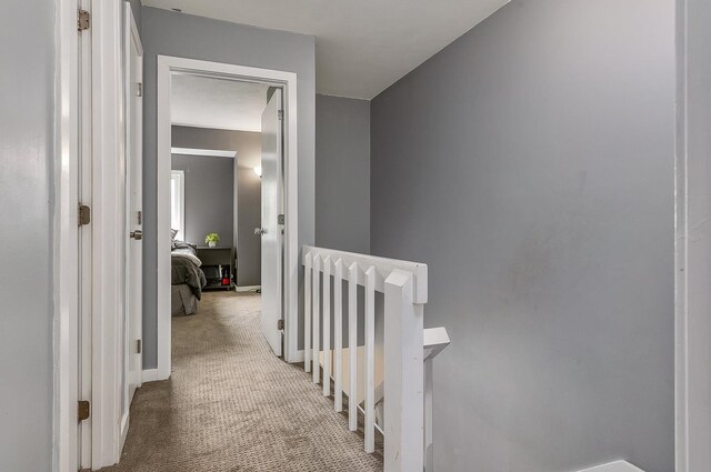 37 Thornhill Rd, Stratham, NH 03885 - hallway featuring an upstairs landing and carpet floors