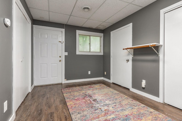 37 Thornhill Rd, Stratham, NH 03885 - entrance foyer featuring a paneled ceiling and dark wood-style flooring