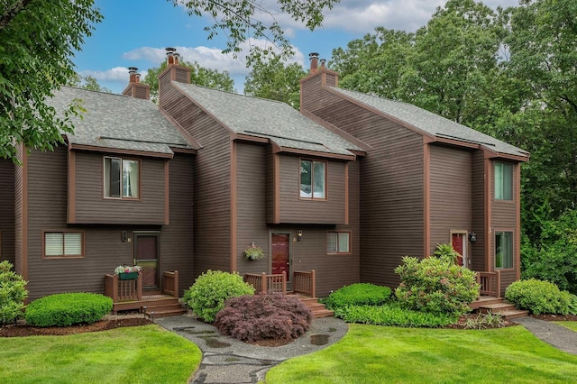 37 Thornhill Rd, Stratham, NH 03885 - view of front of house featuring a front yard and a chimney
