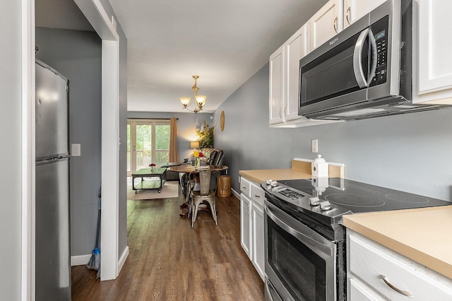 37 Thornhill Rd, Stratham, NH 03885 - kitchen featuring appliances with stainless steel finishes, white cabinets, and a chandelier