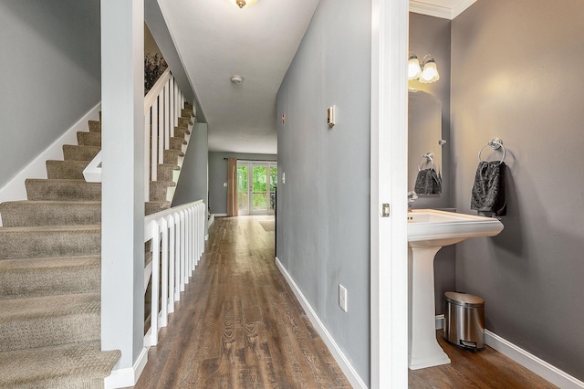 37 Thornhill Rd, Stratham, NH 03885 - hall featuring dark wood-style flooring and stairway