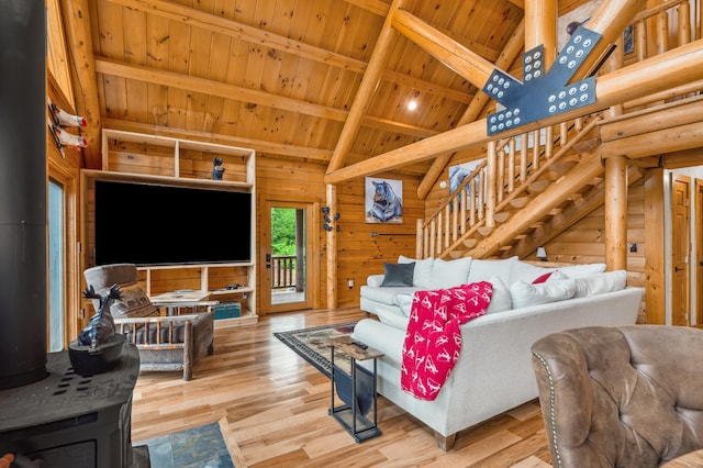 1 Peak Vista Ln, Madison, NH 03849 - living room with a wooden ceiling with exposed beams, wood finished floors, high vaulted ceiling, stairs, and a wood stove