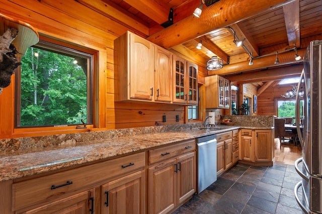 1 Peak Vista Ln, Madison, NH 03849 - kitchen featuring stainless steel appliances, a wood ceiling with exposed beams, stone tile flooring, wooden walls, and light stone countertops